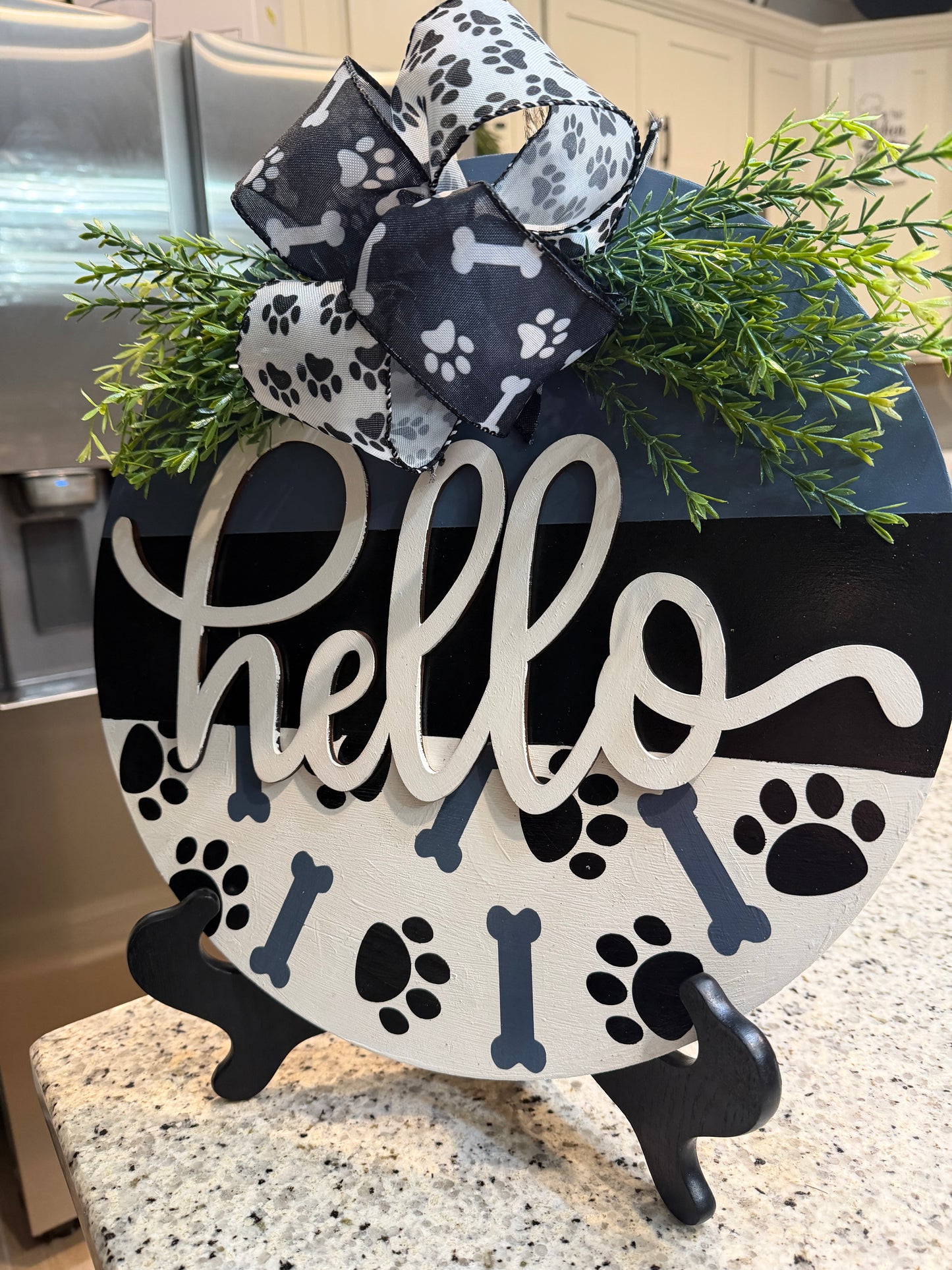 Paw and bones hello sign