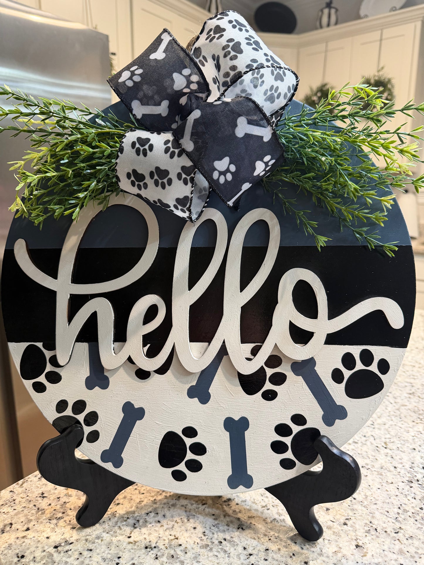 Paw and bones hello sign
