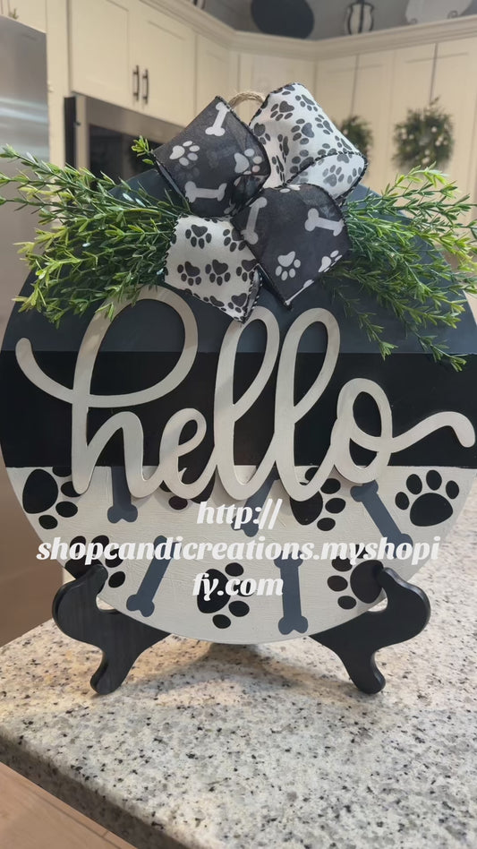 Paw and bones hello sign